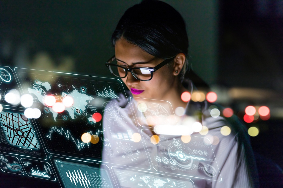 Woman engineer looking at various information in for cyber-physical systems